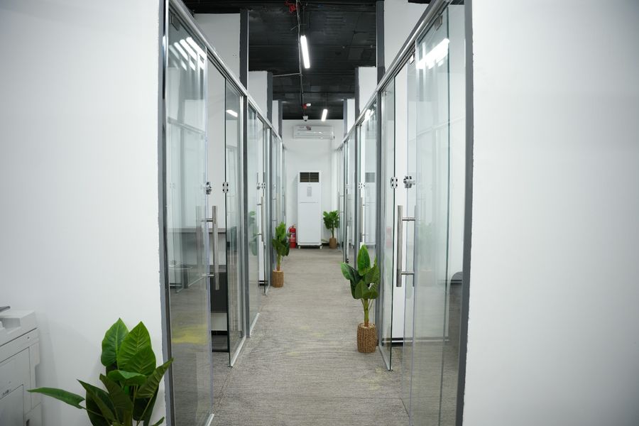 Furnished private office with glass partitions at Business Hub